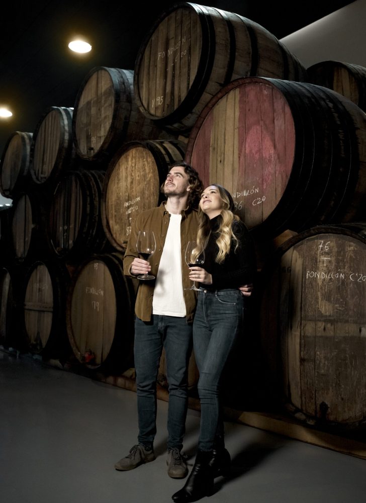 couple at the winery cellar couple at the winery cellar