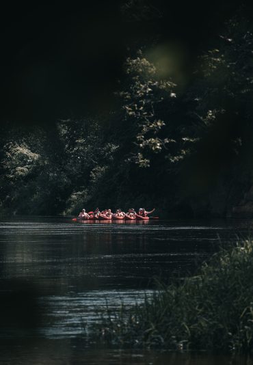 People Canoeing on river