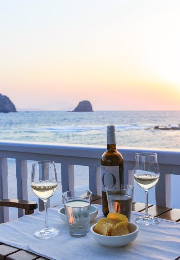 Wine glasses by the sea